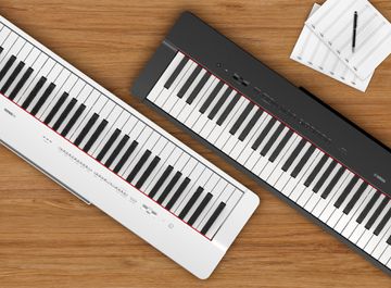 Yamaha P-225 Digital Piano in black and white