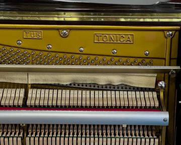 Inside a Tonica TU5 Upright Piano