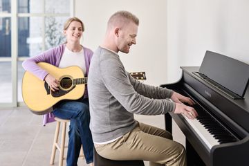 Man playing the Yamaha CLP-845 Clavinova