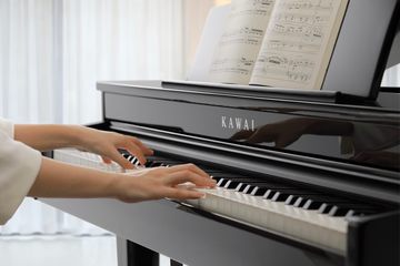 Playing the ebony Kawai DG 30 Digital Grand Piano