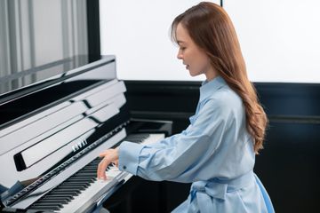 Woman playing the Kawai Novus NV6