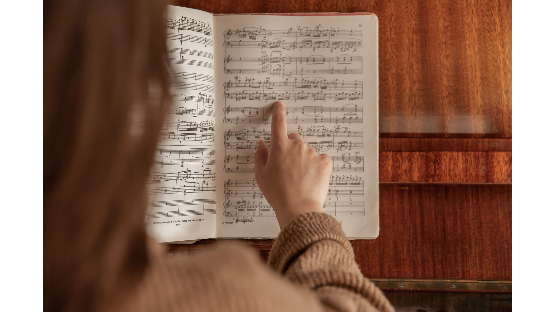 Woman going over music notes