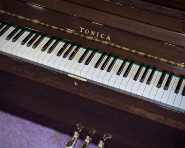 Close up of Tonica TU5 upright piano keys