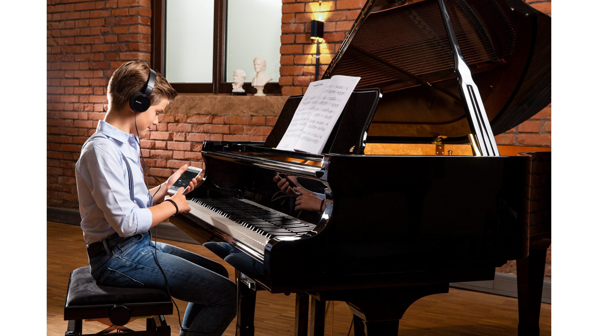 Person playing piano with Adsilent system