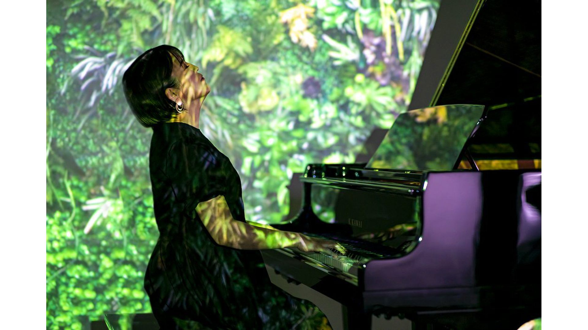 Woman playing Kawai TransAcoustic Piano