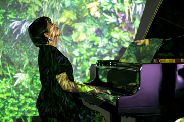 Woman playing Kawai TransAcoustic Piano