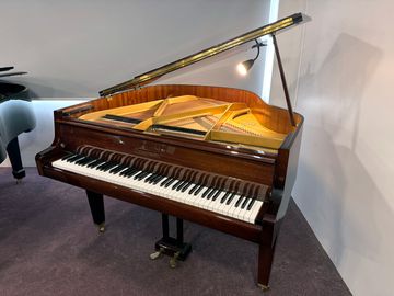 Zimmerman baby grand piano with polished wood finish