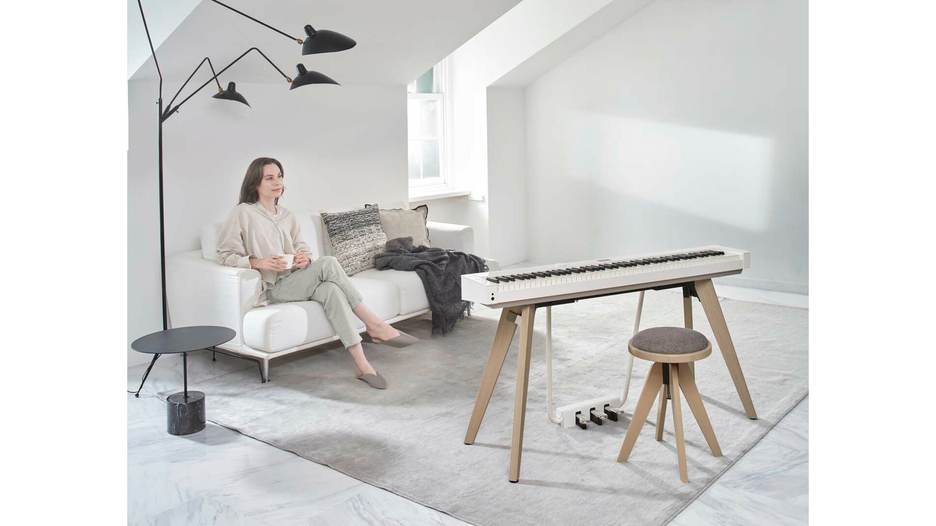 White Casio PX-S7000 piano on stand