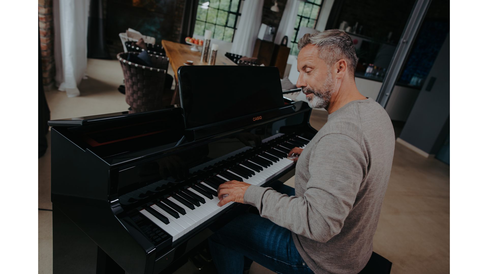 Man playing a Casio Digital Piano