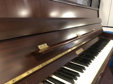 Close-up of Baldwin Used Dark Mahogany Piano
