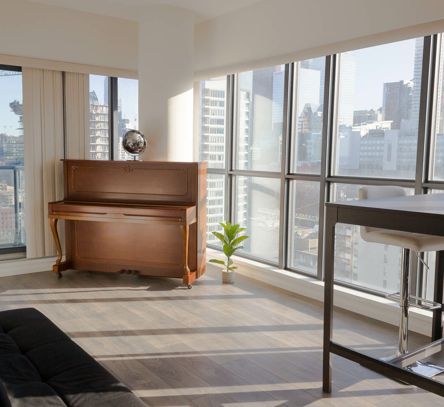 Acoustic piano by window