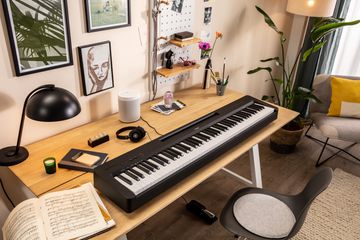 Yamaha P-145BT Portable Digital Piano on desk